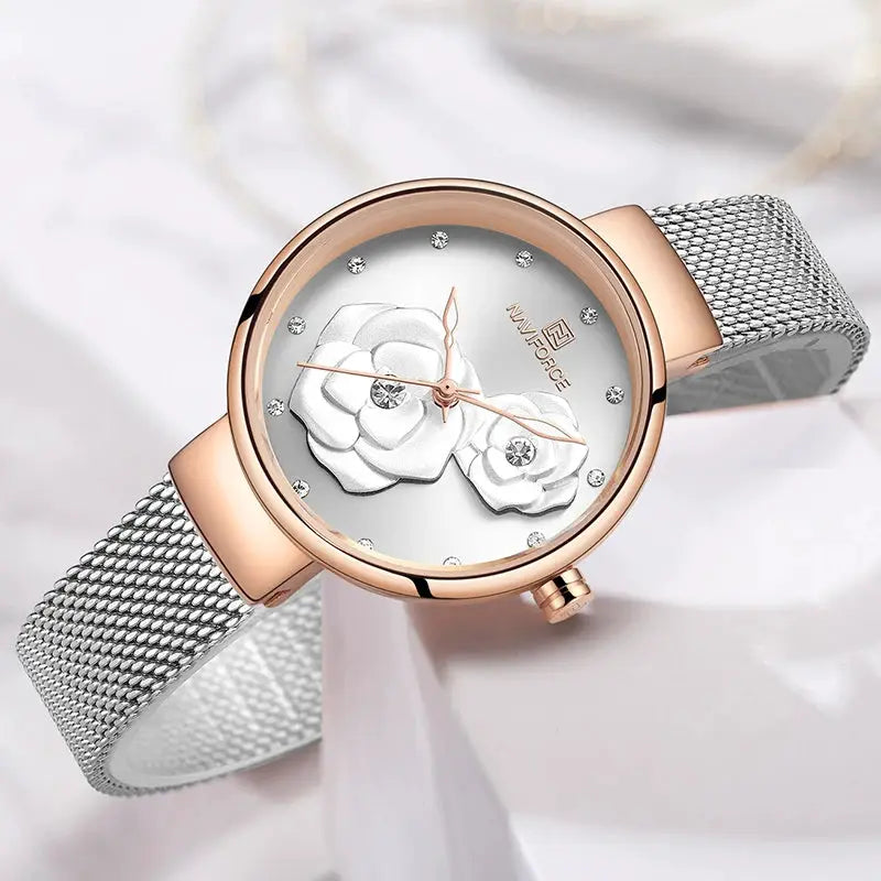Women's NAVIFORCE watch with rose-gold case, silver mesh band, white dial featuring floral design and crystal markers