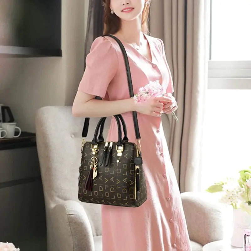 Fashion English Letter Handbag PU leather tassel top-handle tote, black with gold hardware, large capacity
