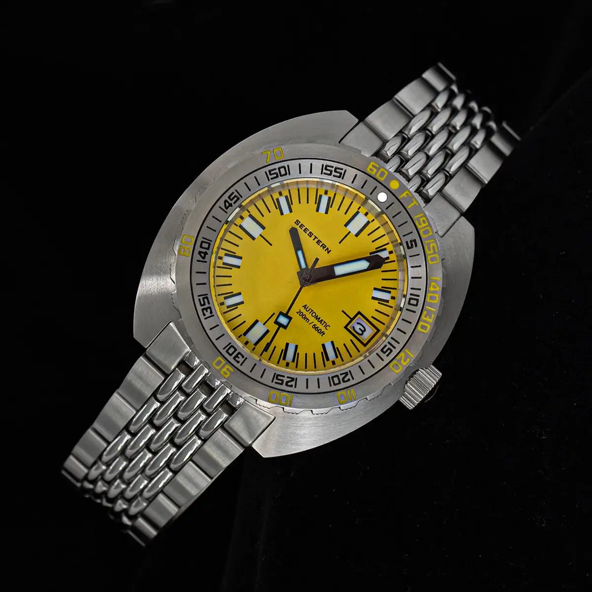 Seestern diver watch with yellow dial, stainless steel bracelet, automatic movement, 200m water resistance and date display.