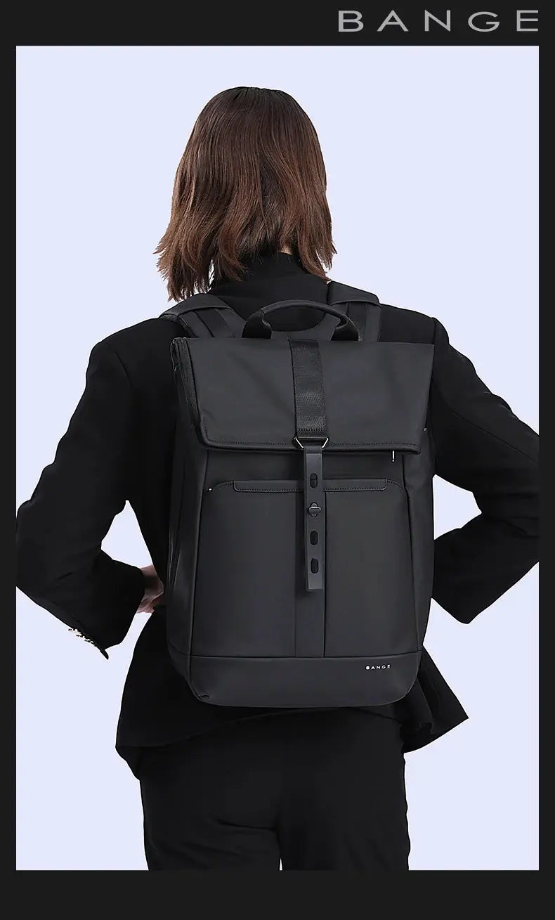 BANGE black anti-theft waterproof laptop backpack for 15.6-inch laptops, worn by a person in a black outfit.