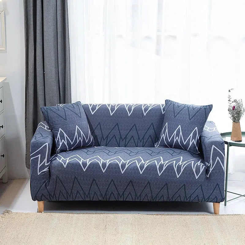Sofa slipcover for L-shaped couch with two cushions, blue stretch fabric with white zigzag print.