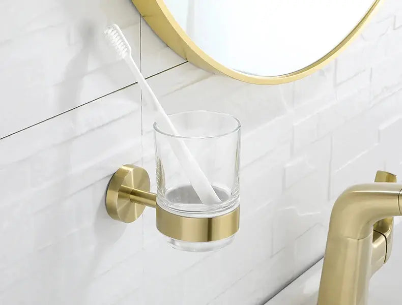 Simples Market brushed gold wall-mounted toothbrush holder with glass tumbler