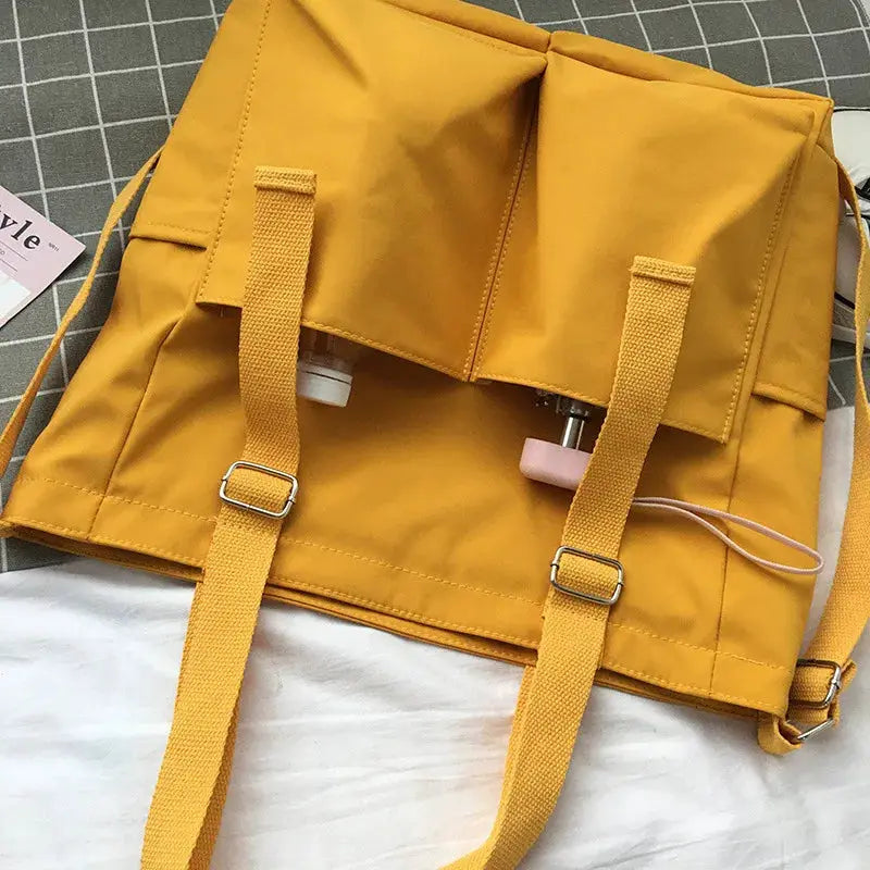 Waterproof Oxford large-capacity women's shoulder bag by Simples Market in mustard yellow with adjustable straps