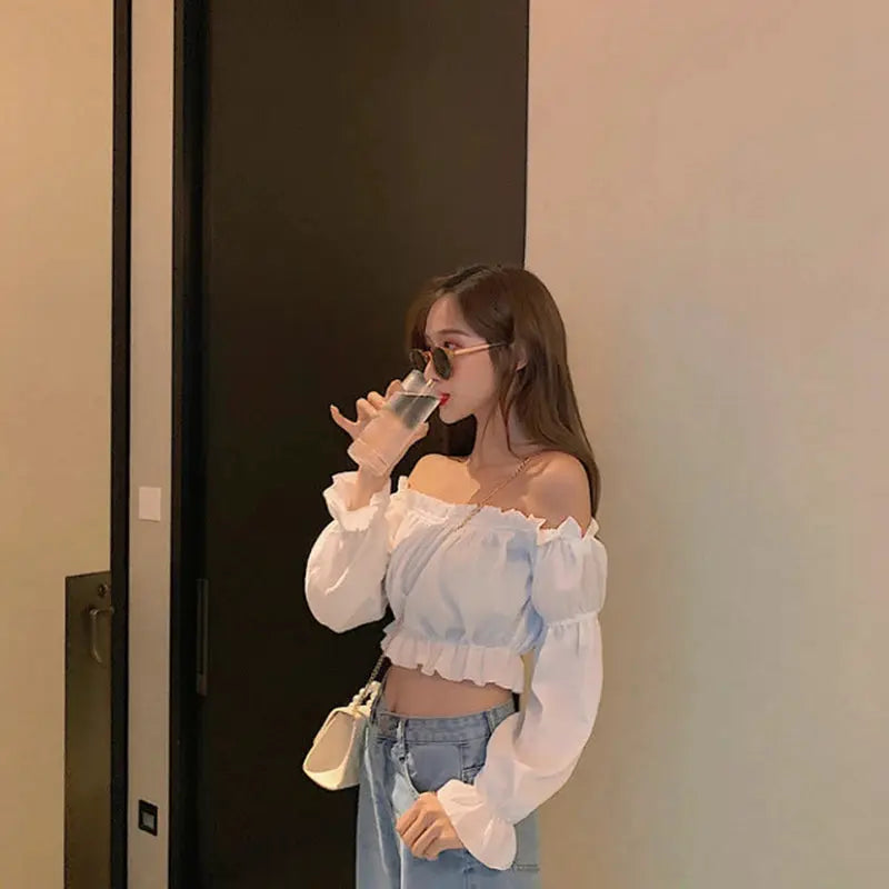 Off-shoulder white puff-sleeve blouse with ruffle, cropped long-sleeve top
