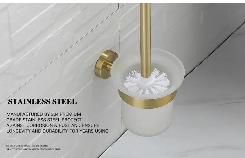 Bathroom hardware set by Simples Market in brushed gold with wall-mount toilet brush holder in white canister.