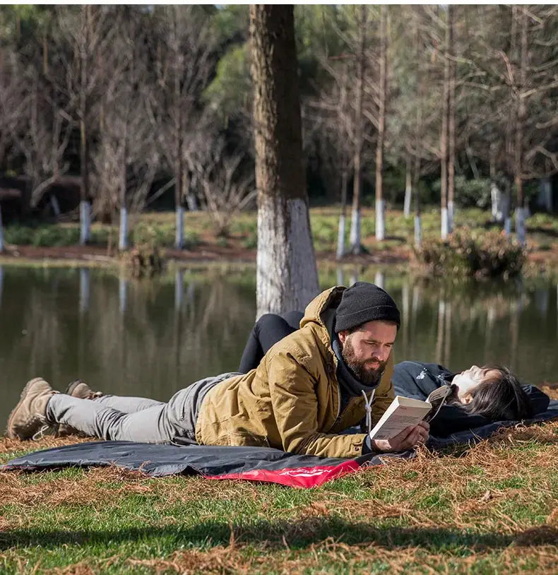 Naturehike picnic blanket pocket beach mat; waterproof, sand-free, black top with red underside.