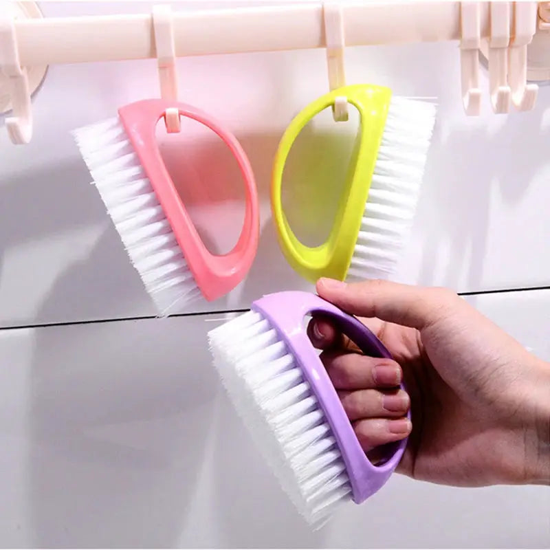 Colorful egg-shaped cleaning brush set by Simples Market with purple, pink and yellow handles and white bristles (3 pcs)