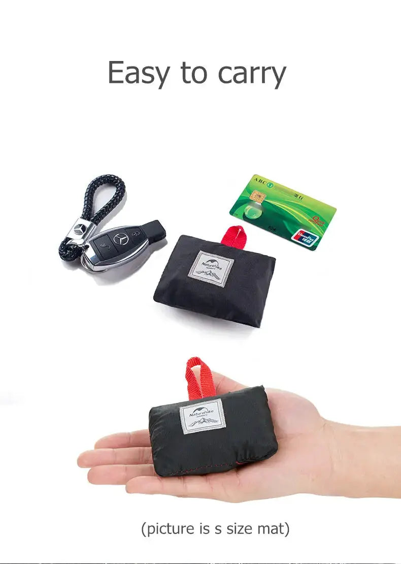 Naturehike pocket beach mat, black waterproof picnic blanket with red carry loop and pouch