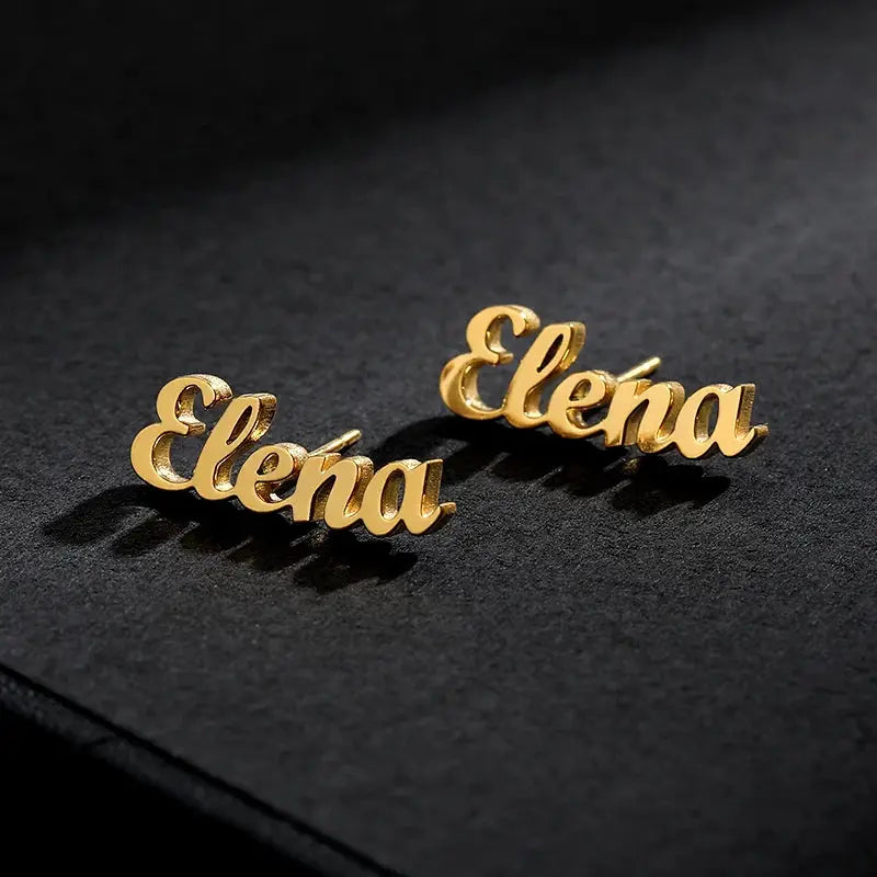 Gold-tone stainless steel Elena nameplate earrings by Simples Market (1 pair)