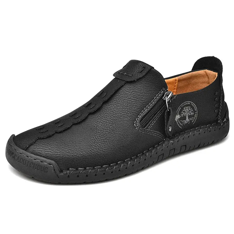 Black leather men’s slip-on loafers by Simples Market with side zipper and moccasin stitching