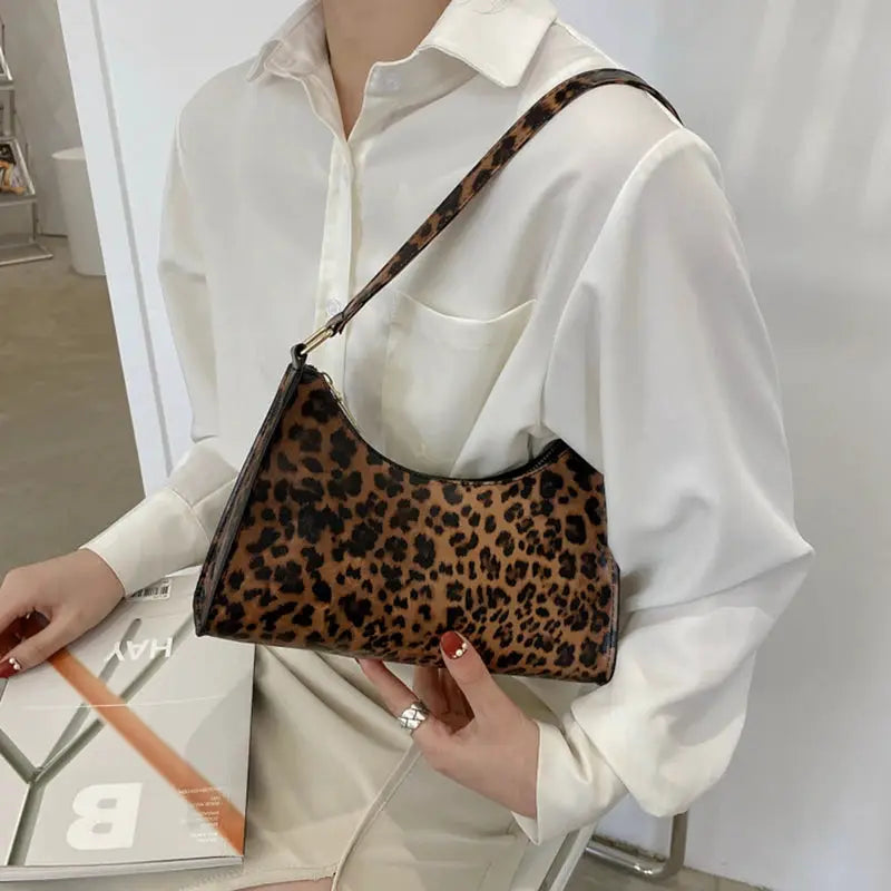 Shoulder bag leopard print PU leather for women with brown tones and black trim.