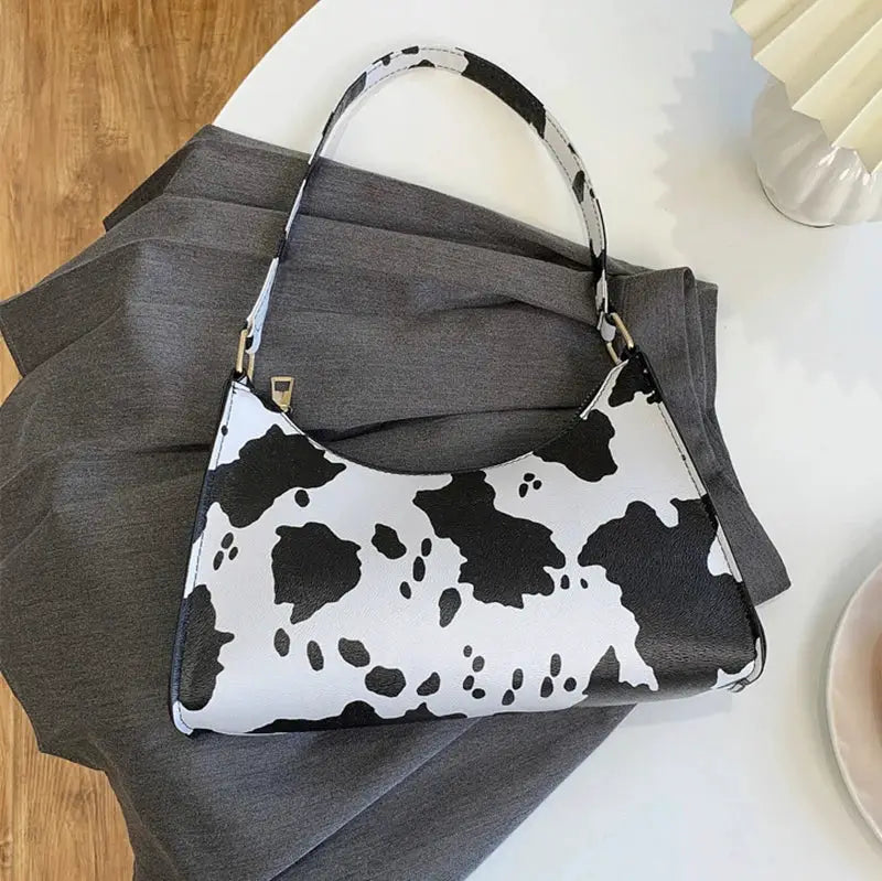 Cow-print PU leather shoulder bag for women with black and white pattern