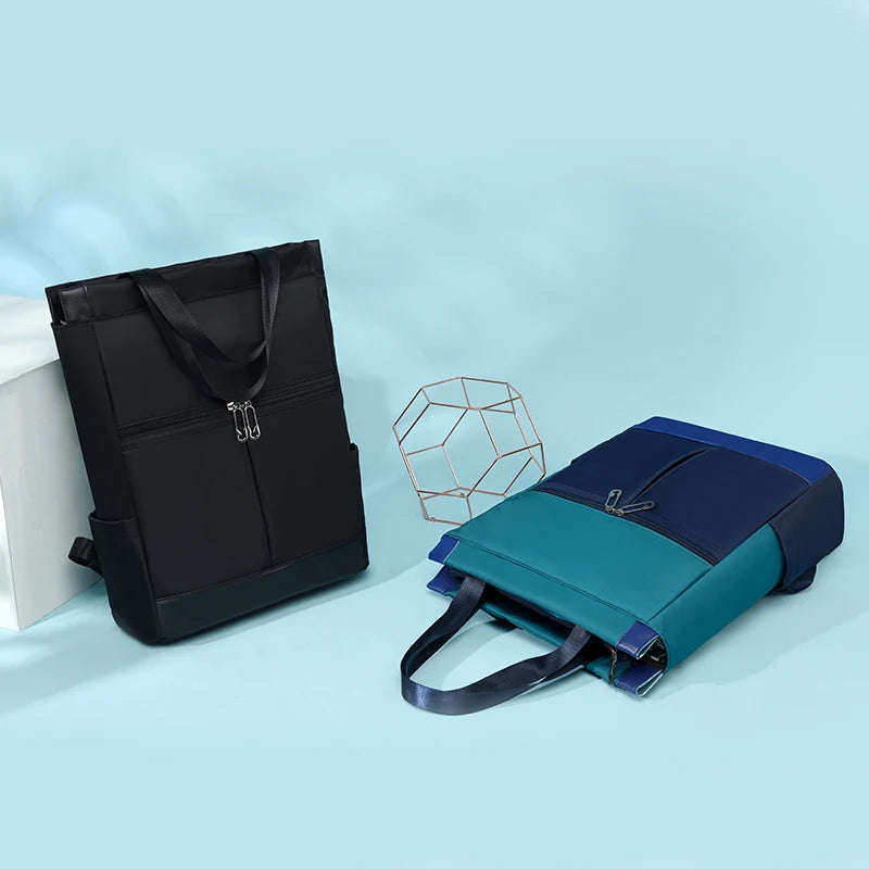 Two women's Simples Market waterproof Oxford backpacks in black and teal color-block designs for school and travel