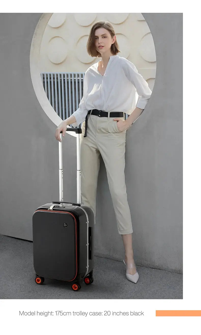 Carry-on rolling suitcase, black with red trim and orange wheels