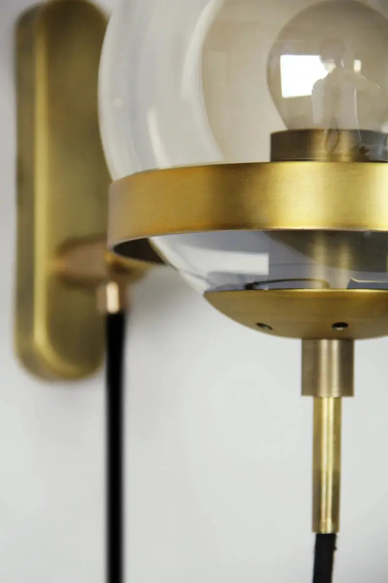 Modern glass ball wall lamp by Simples Market, brass ring, clear globe, E27 fixture