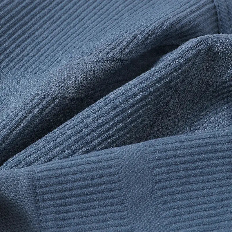 Seamless bralette fabric in navy blue ribbed knit.