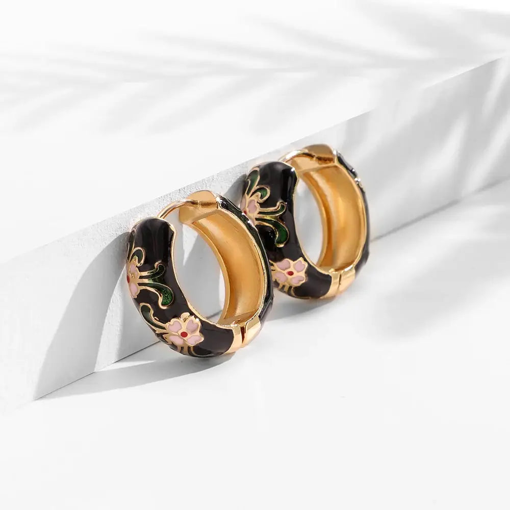 Simples Market enamel flower huggie hoop earrings set of 3, black enamel with gold trim and pink floral accents