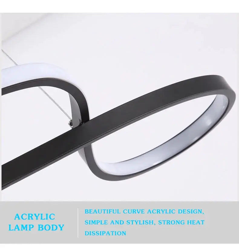 Pendant lamp with a black circular acrylic ring and white LED glow for modern kitchen island lighting.