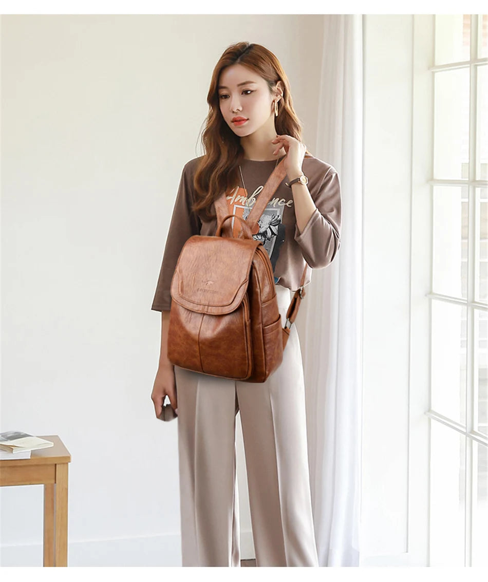 Genuine women's soft leather backpack by Simples Market in brown, fashionable school bag.