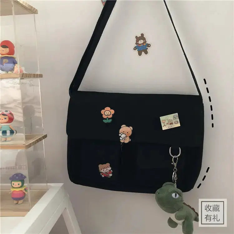 Simples Market women's black canvas messenger bag with cute character prints, crossbody style