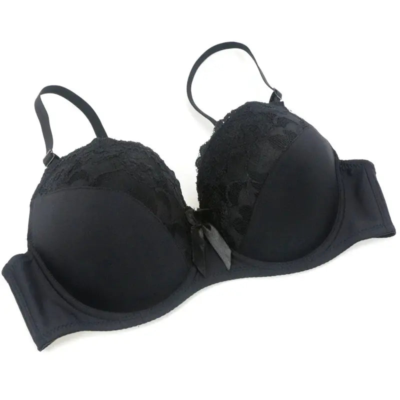 Black lace push-up bra with underwire, floral lace cups and center bow; adjustable straps.