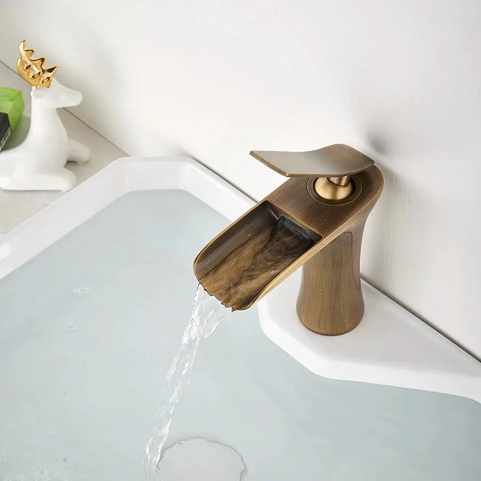 Antique-brass basin faucet with waterfall spout and single-handle for bathroom sink