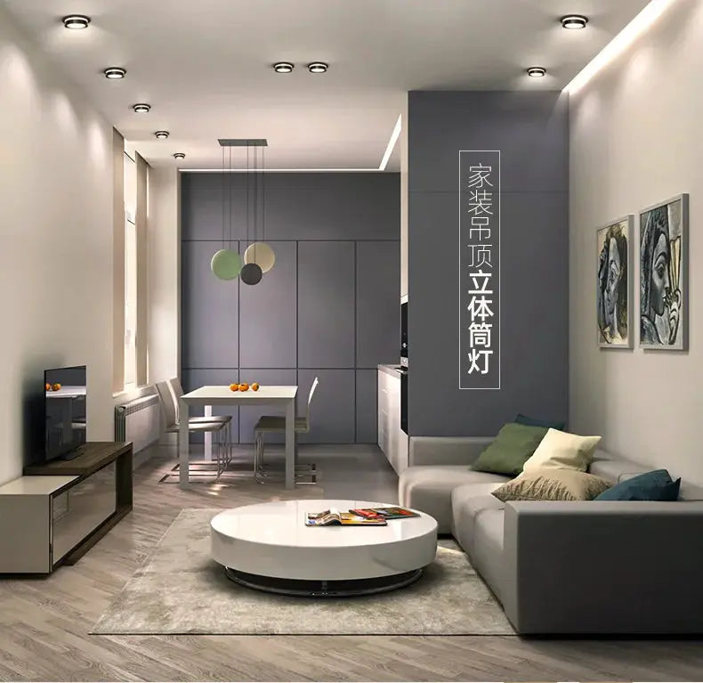 Chrome round recessed LED downlight fixtures installed in a modern open-plan living room and kitchen.