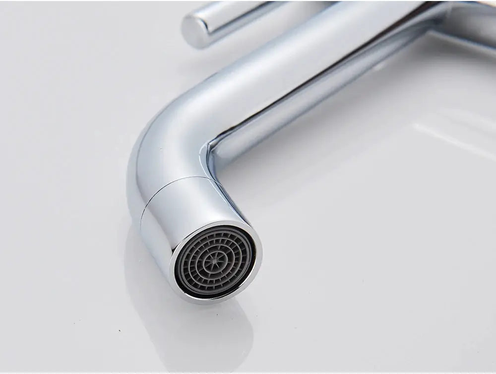 Basin faucet with chrome finish and aerator end for bathroom sink