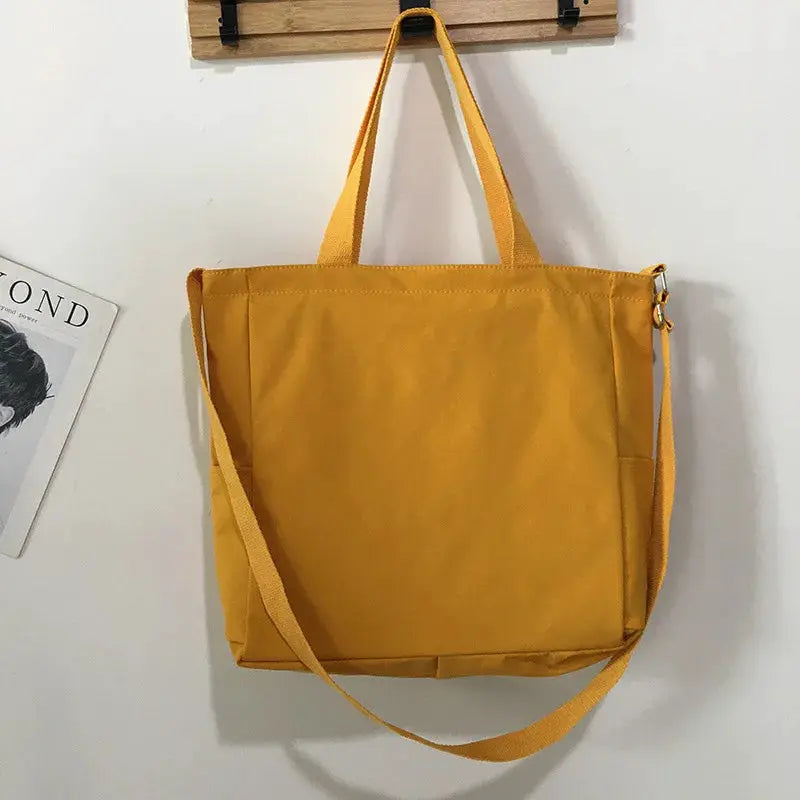 Waterproof Oxford large-capacity women's handbag in mustard yellow with dual handles and detachable crossbody strap