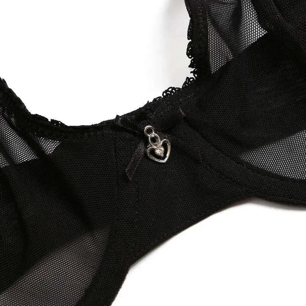 Bra in black lace mesh see-through with a small silver heart charm