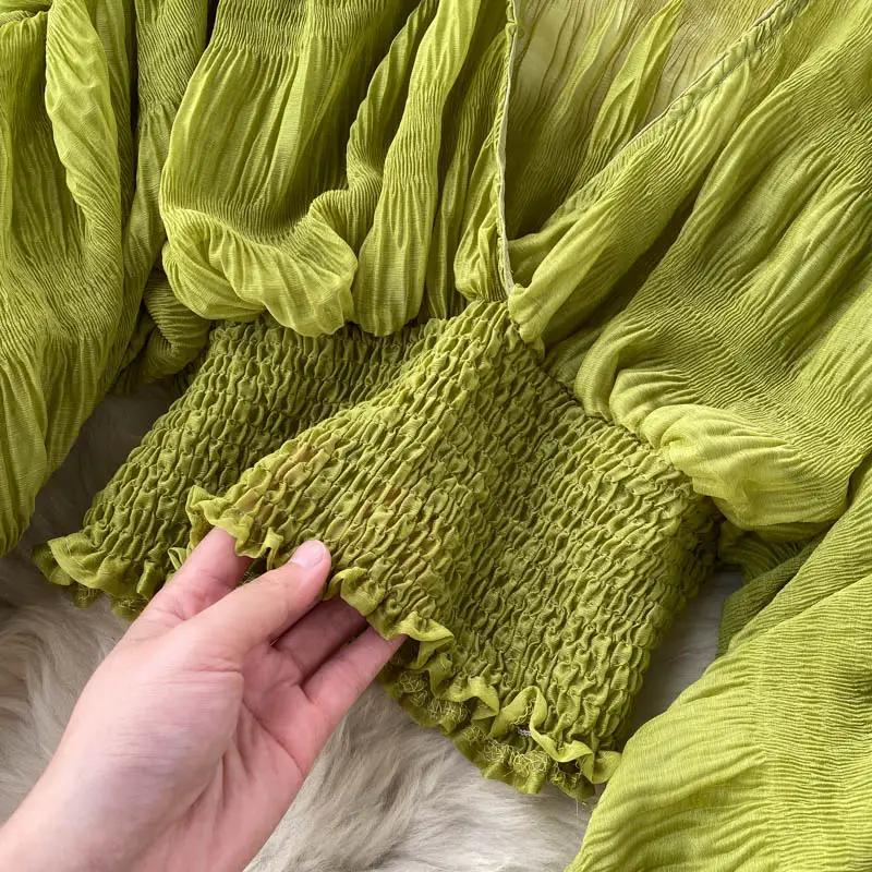Chiffon blouse in lime green with a smocked waist and puff long sleeves from Simples Market.