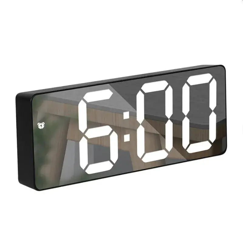 Simples Market acrylic mirror digital alarm clock with large white LED digits on a black desk clock.