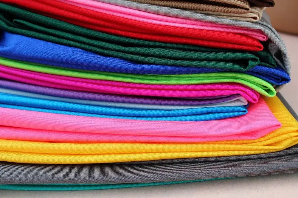 Women's shiny leggings in assorted bright colors; stretchy spandex blend with elastic waist for casual wear.