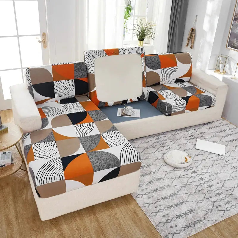 Geometric print furniture protector for corner sofa with elastic stretch slipcover in orange, beige, and gray