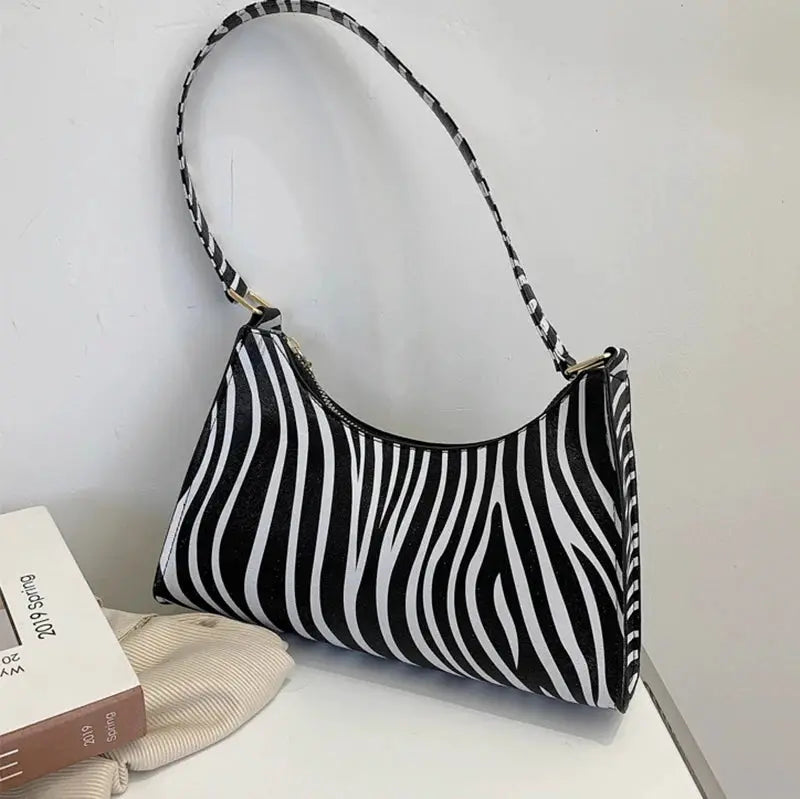 Simples Market zebra print PU leather shoulder bag with black-and-white stripes and matching strap