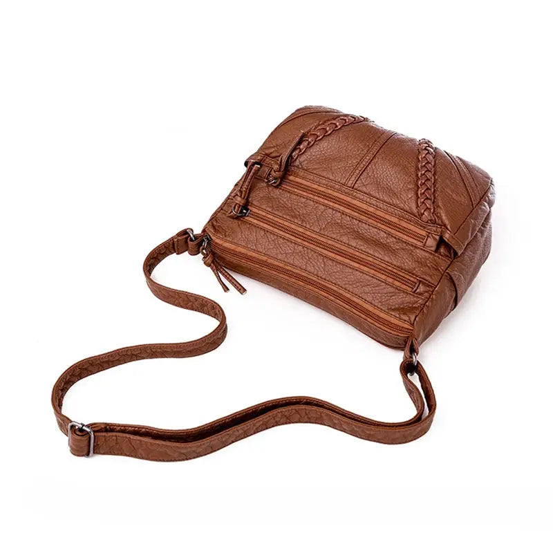 Brown PU leather women's messenger bag with multiple zip pockets and an adjustable strap