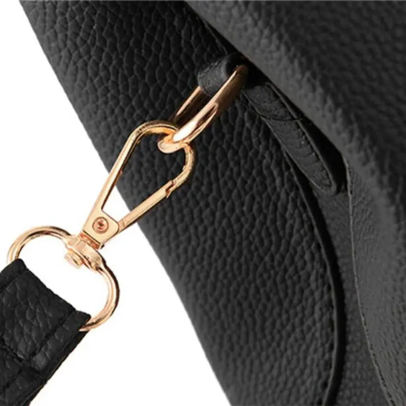 Elegant shoulder bag for women by Simples Market, black pebble-leather with gold-tone hardware