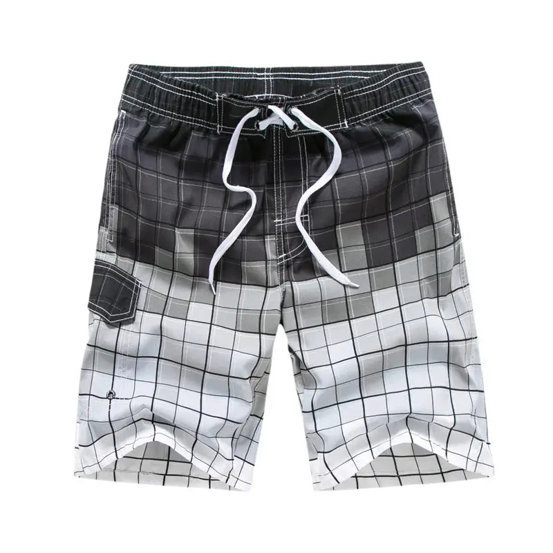 Men's board shorts with black-to-white gradient grid pattern, white drawstring, cargo pocket