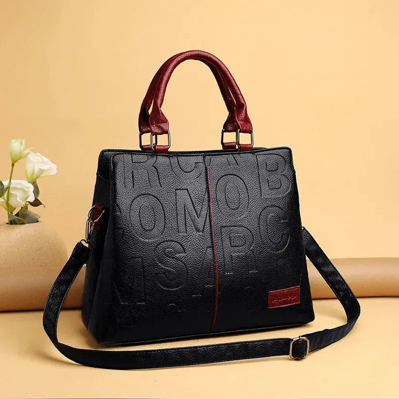 Simples Market PU leather crossbody bag, black with red handles, embossed lettering and red seam