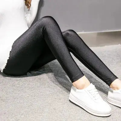 Women's black shiny stretch leggings, form-fitting casual pants for everyday wear