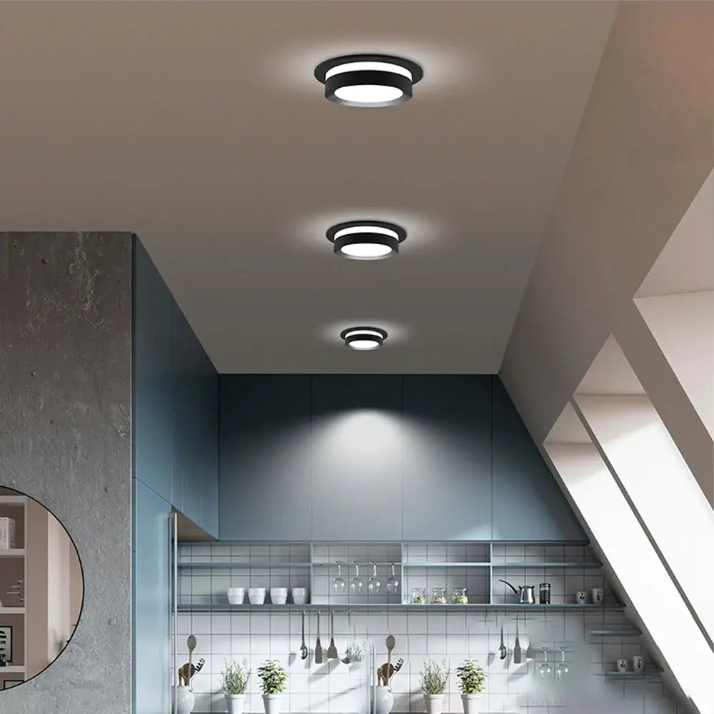 Chrome round recessed LED downlights (set of 3) on a kitchen ceiling with acrylic diffusers.