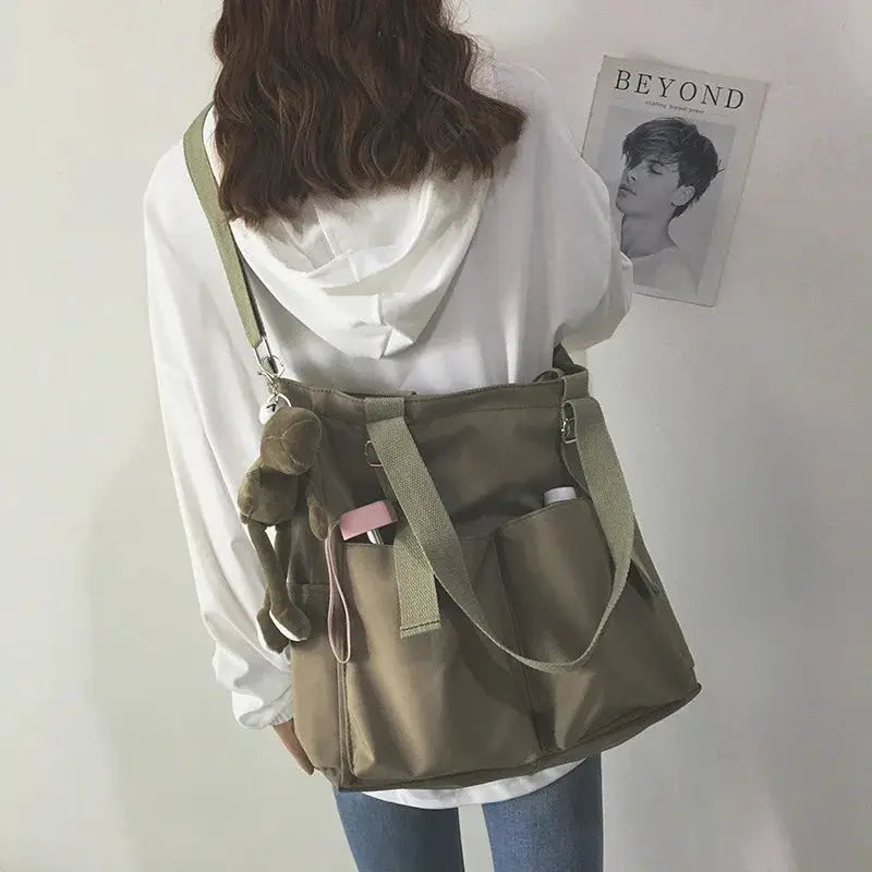 Waterproof Oxford large-capacity handbag for women by Simples Market, olive tote with shoulder strap.
