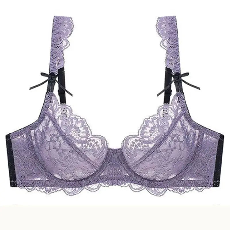 Purple lace push-up bra with sheer mesh, scalloped edges, and black ribbon bows.