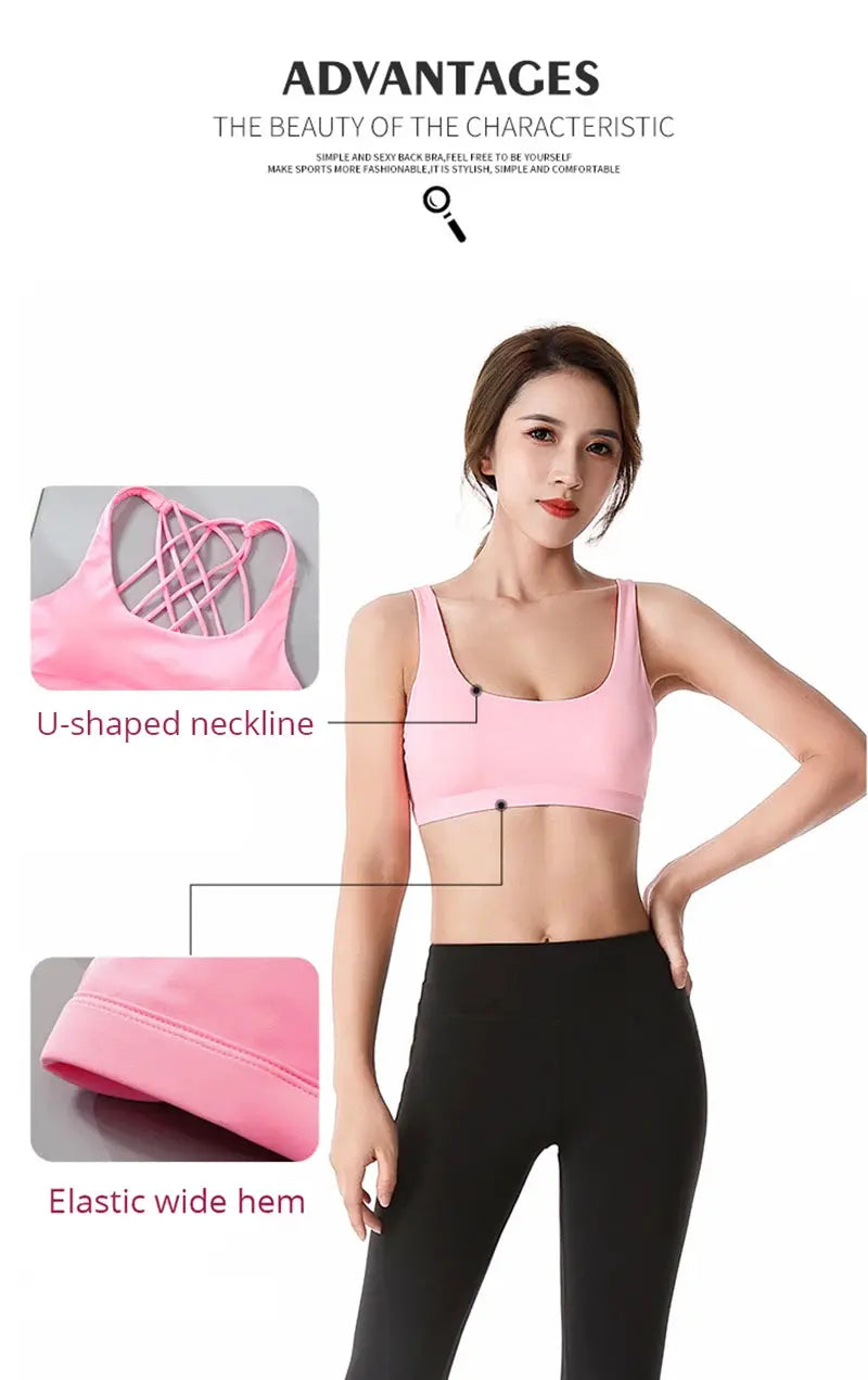 Pink women's fitness sports bra with U-shaped neckline, cross-back lattice straps and elastic wide hem