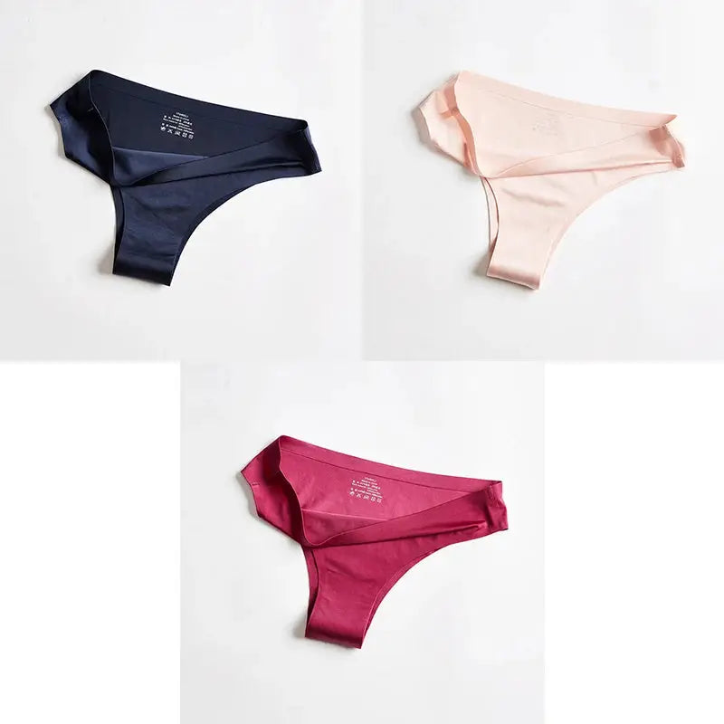 Three-pack women's seamless thong underwear in navy, peach, and magenta ice-silk fabric