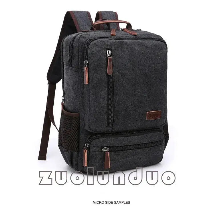 Vintage canvas backpack for men by Simples Market, dark grey with brown leather zipper pulls and multiple pockets
