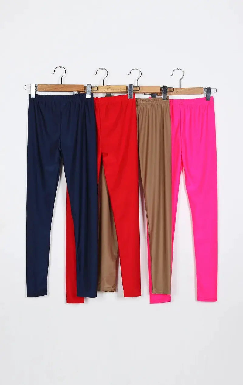 Womens shiny pant leggings, five solid-color pairs in navy, red, taupe, hot pink, and neon pink.