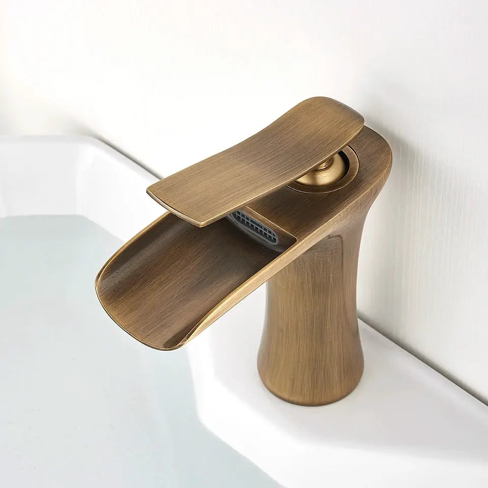 Waterfall basin faucet with antique brass finish, single-handle mixer by Simples Market