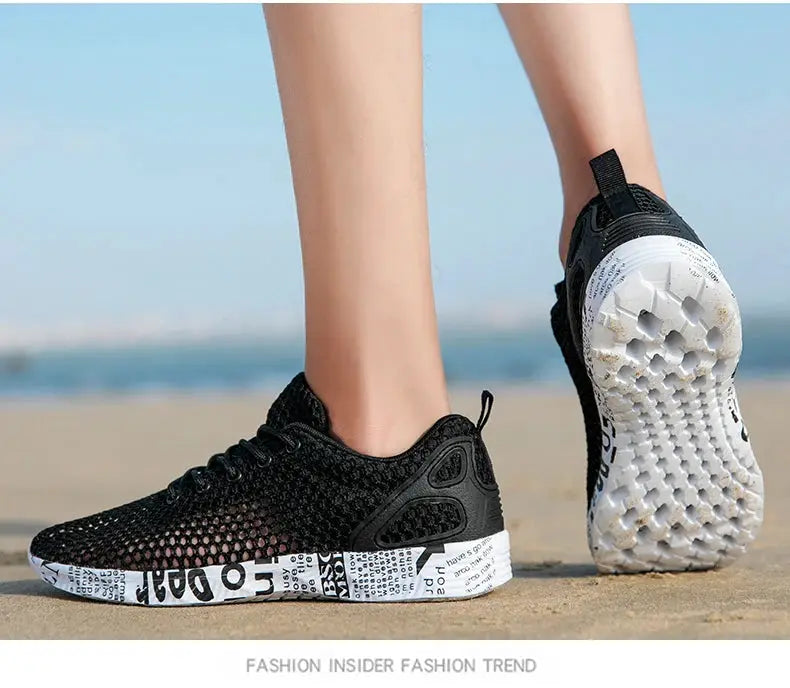Men's black mesh water shoes with white printed foam sole; beach-ready summer sneakers