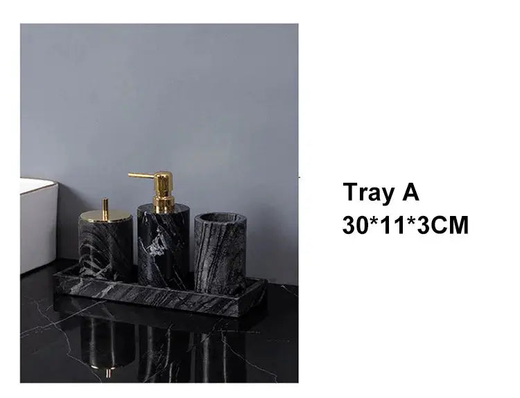 Simples Market four-piece black marble bathroom set with gold pump soap dispenser, toothbrush holder, and tray